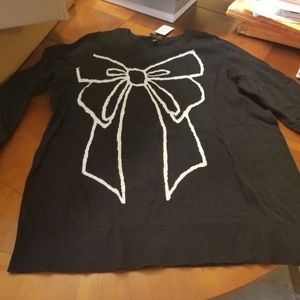 Black sweater with bow print. New. Size 1.